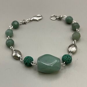 Elegant Green and Silver Bracelet with Intricate Design